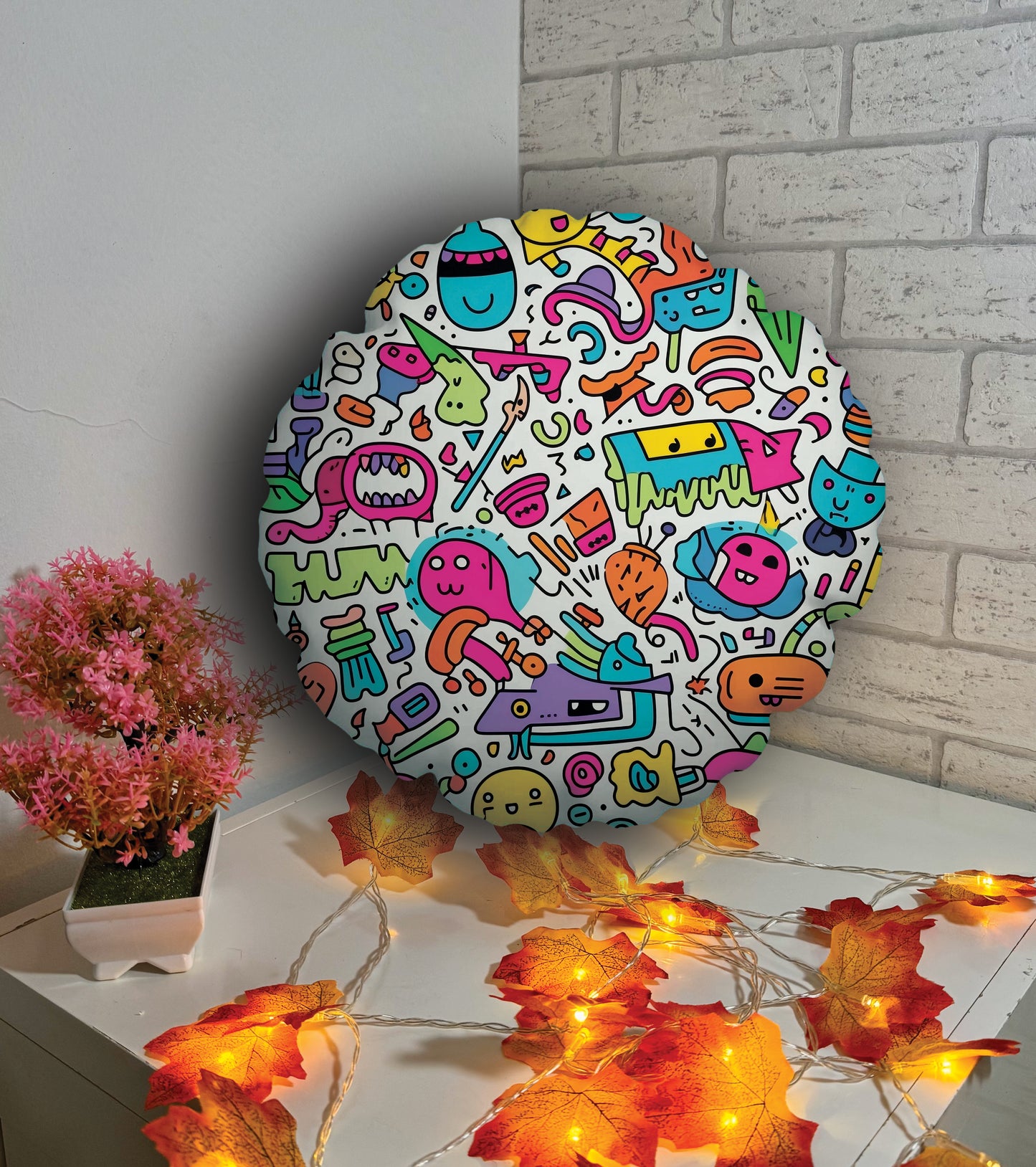 Oreiller rond - griffonnages colorés